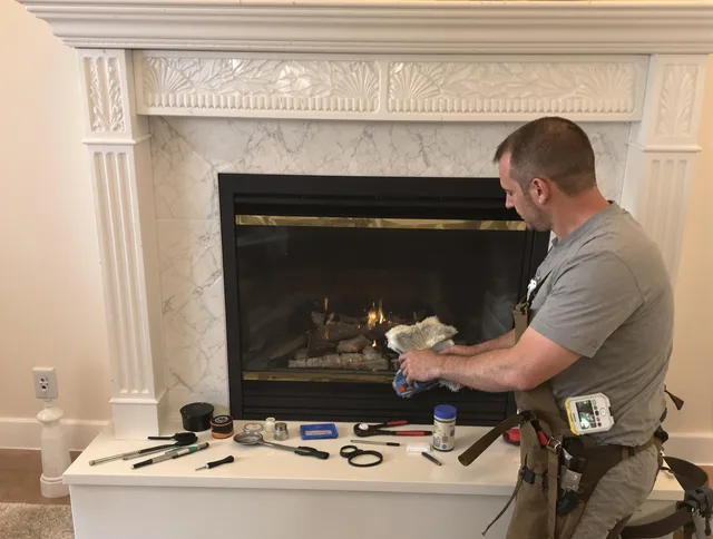 Tyngsborough Chimney Sweep performing fireplace maintenance in Tyngsborough, MA