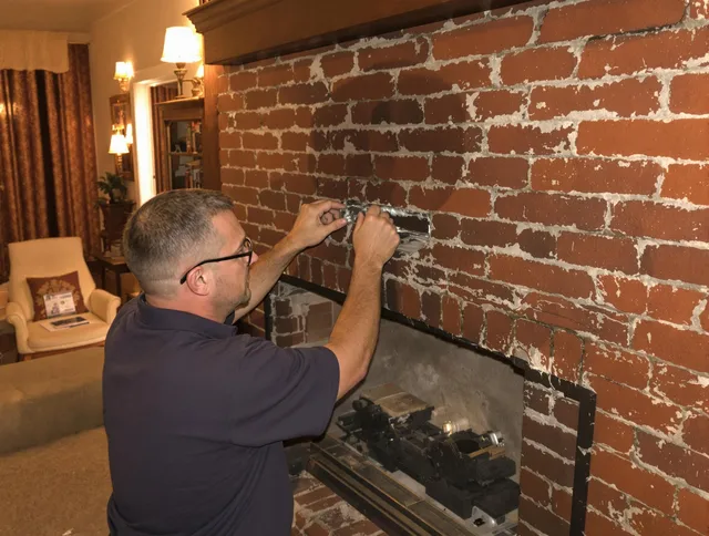 Tyngsborough Chimney Sweep expert fixing a fireplace in Tyngsborough, MA